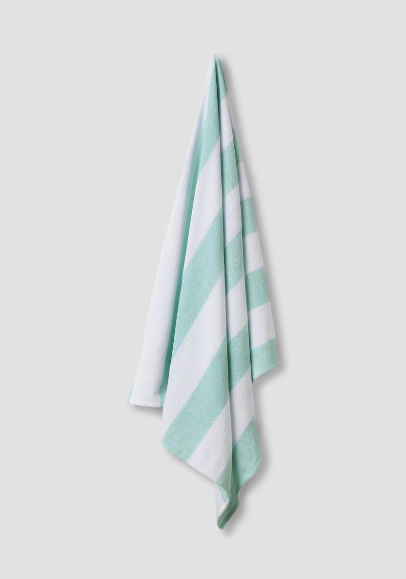 Striped swimsuit with towel and sunglasses